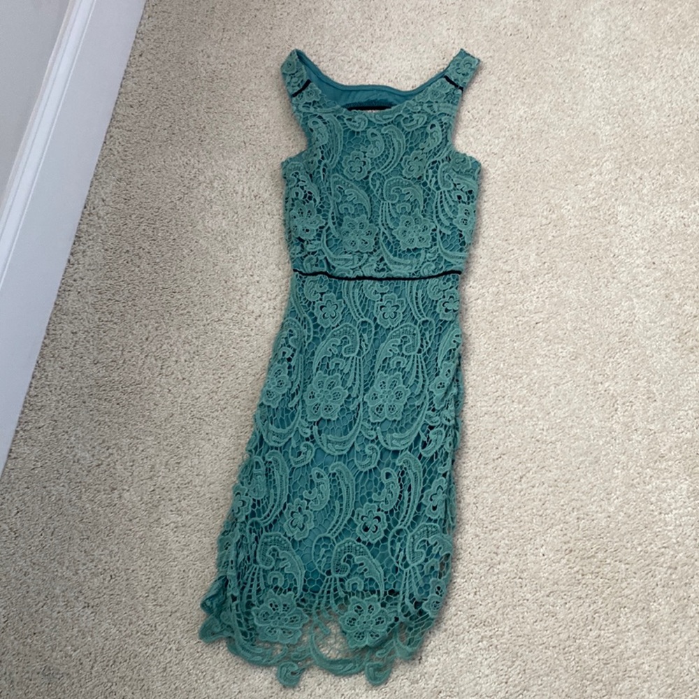 Darker mint lace dress with fun peep hole back